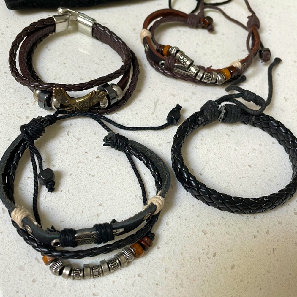 4 Vintage Fibosteel Leather Bracelets with two storage bags